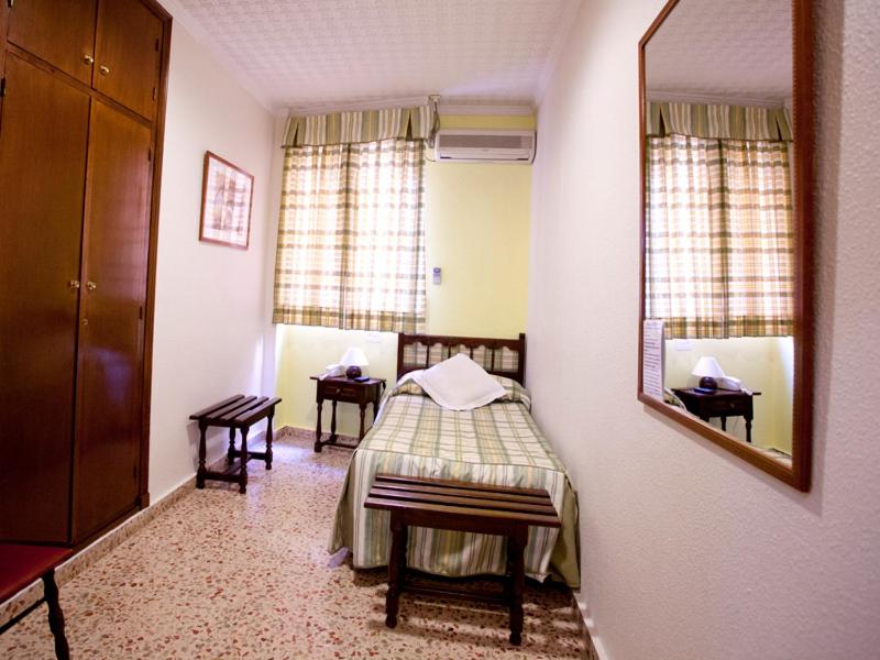 Postel nebo postele na pokoji v ubytování Hotel Costa