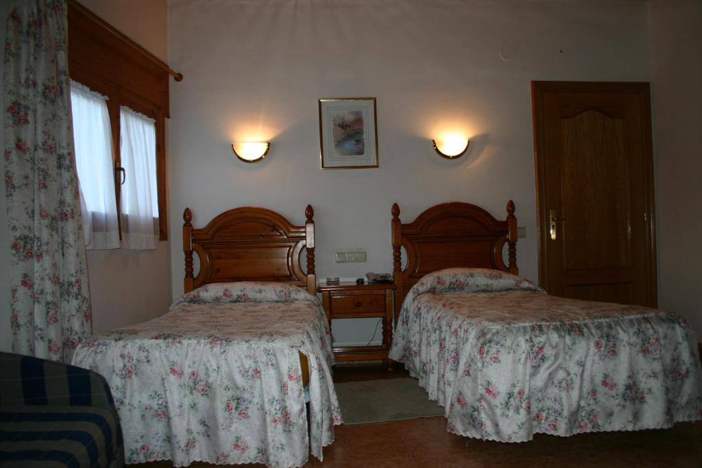Postel nebo postele na pokoji v ubytování Hotel Can Mestre