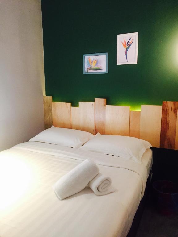Postel nebo postele na pokoji v ubytování Finess Basic Hotel