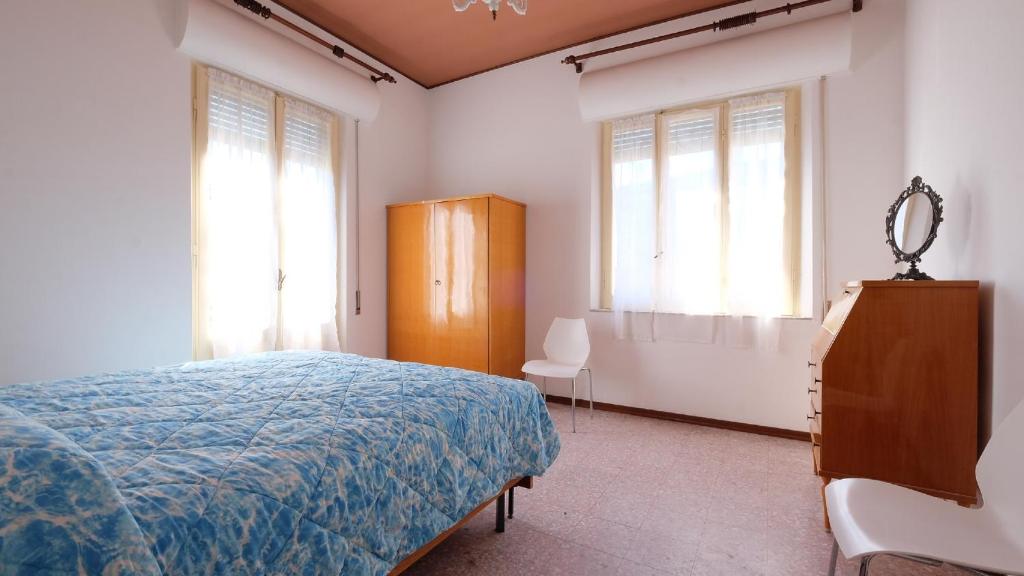 A bed or beds in a room at Orchidea 2 Pineto Vacanza