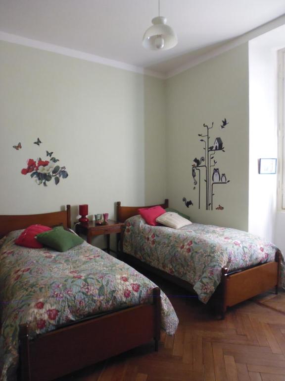 a bedroom with two beds and a window at Il Platano in Como