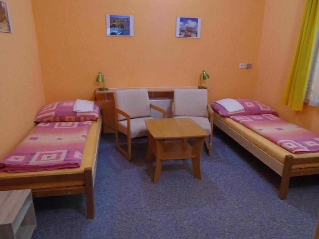 Łóżko lub łóżka w pokoju w obiekcie Pension Dobroucky
