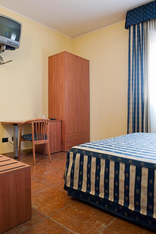 Postel nebo postele na pokoji v ubytování Hotel Blue Ribbon
