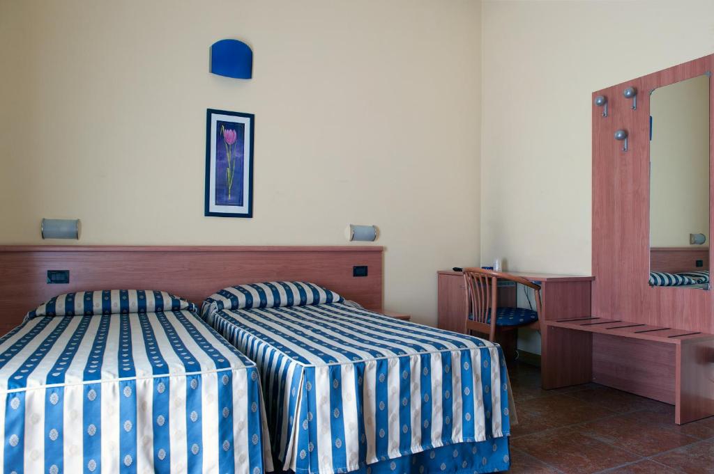 Postel nebo postele na pokoji v ubytování Hotel Blue Ribbon