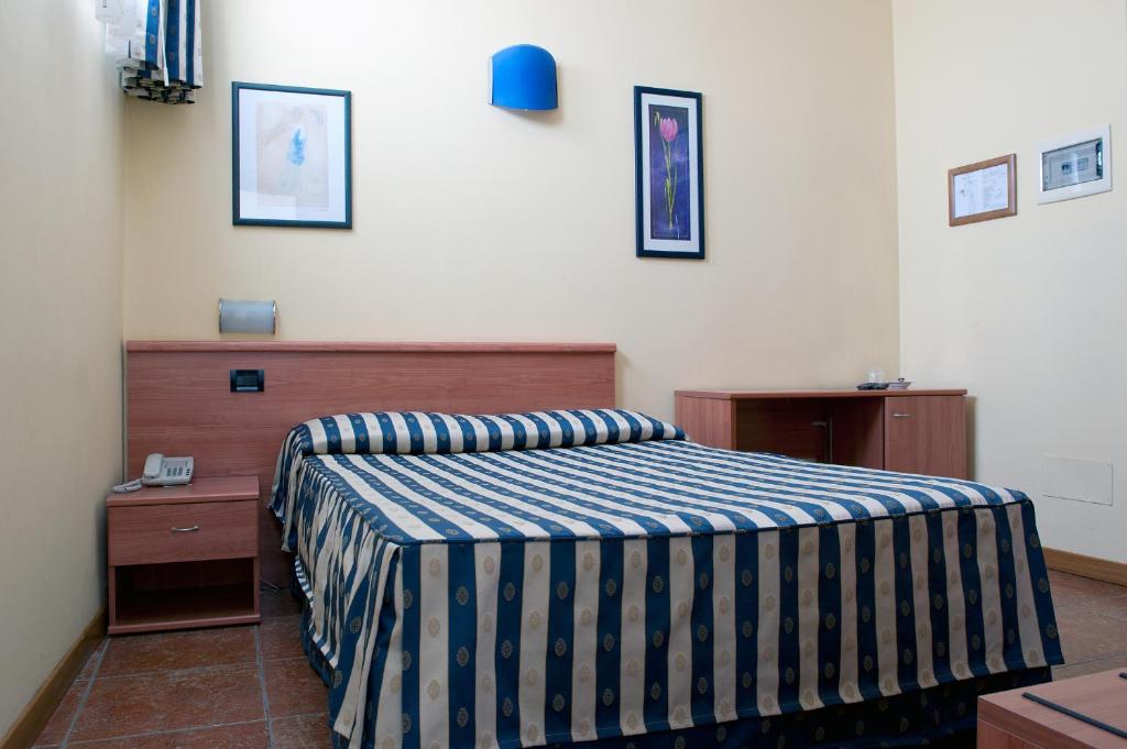 Postel nebo postele na pokoji v ubytování Hotel Blue Ribbon