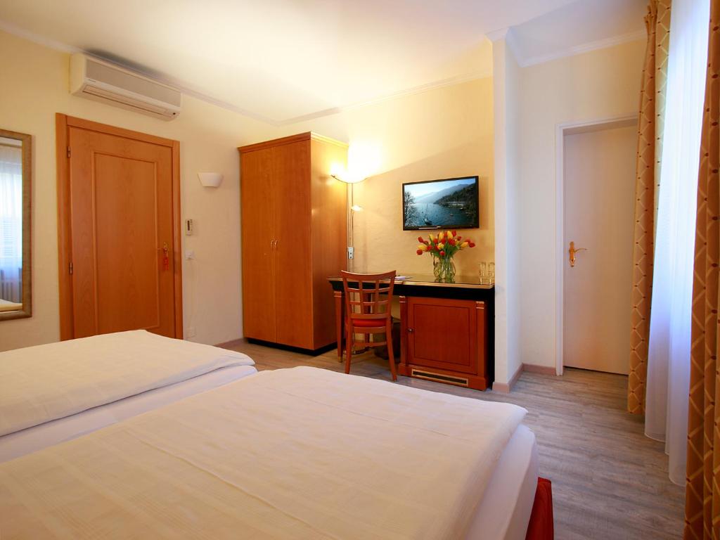 Una cama o camas en una habitación de Hotel Garni Golf