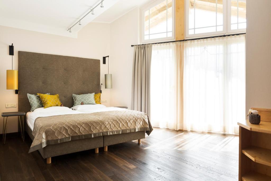Postel nebo postele na pokoji v ubytování Hotel Burggräflerhof