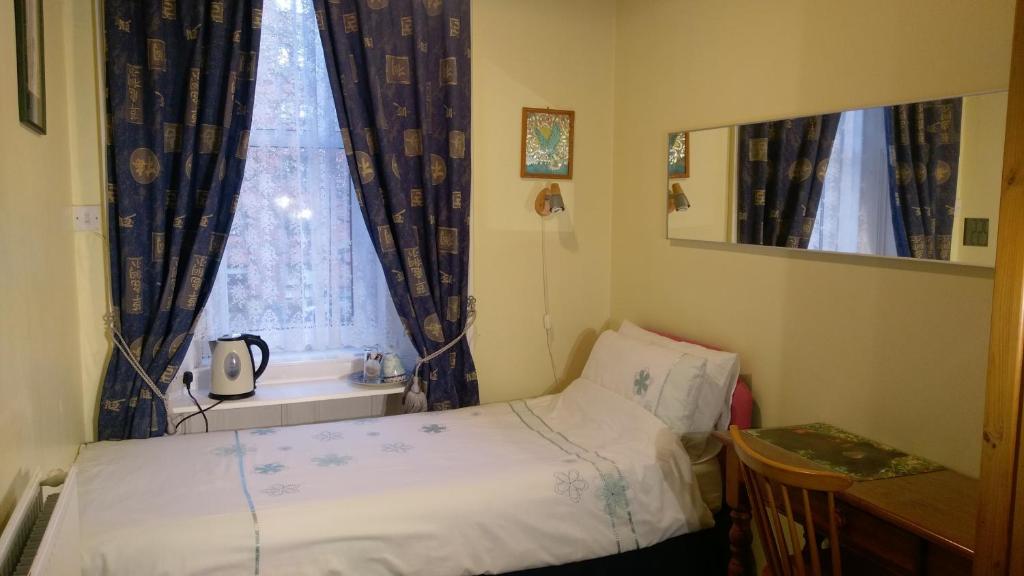 Postel nebo postele na pokoji v ubytování Badjao B&B