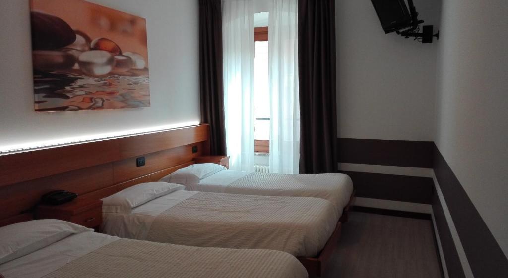 Postel nebo postele na pokoji v ubytování Albergo Ristorante Da Neni