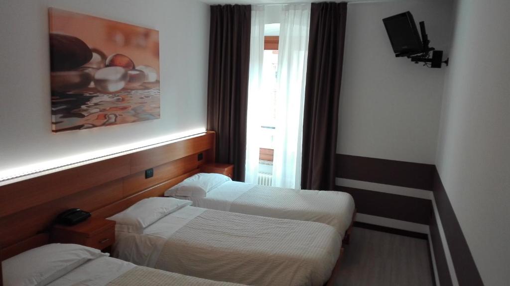Postel nebo postele na pokoji v ubytování Albergo Ristorante Da Neni