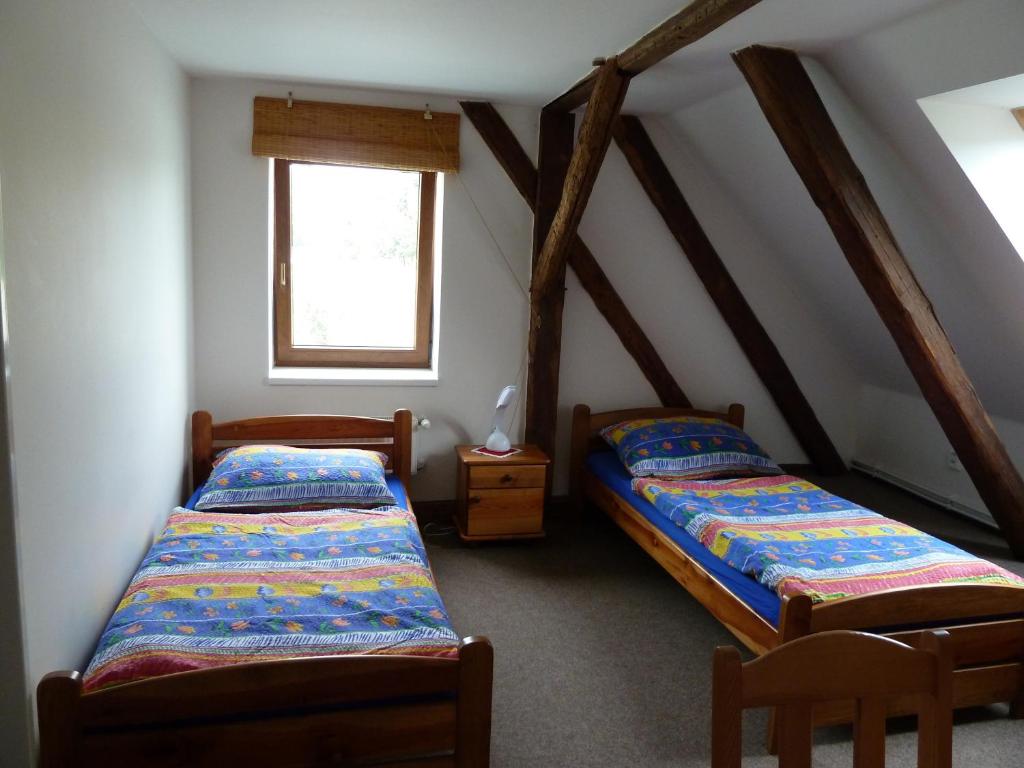Postel nebo postele na pokoji v ubytování Ubytování Mlýn