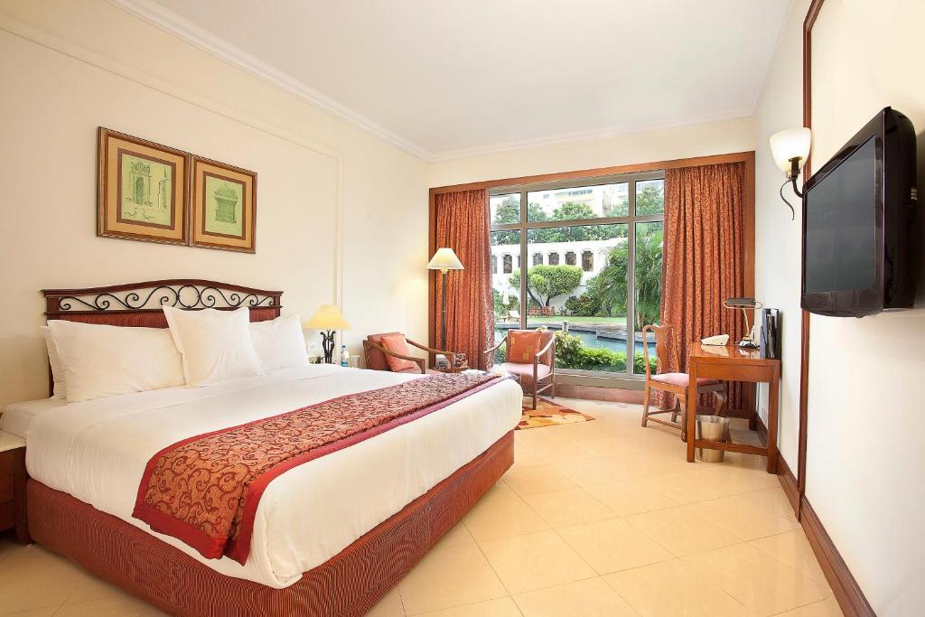 Postel nebo postele na pokoji v ubytování Welcomhotel by ITC Hotels, Alkapuri, Vadodara