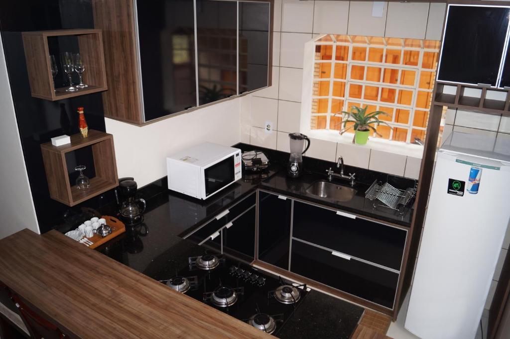 
A cozinha ou cozinha compacta de Apartamento no centro de Canela
