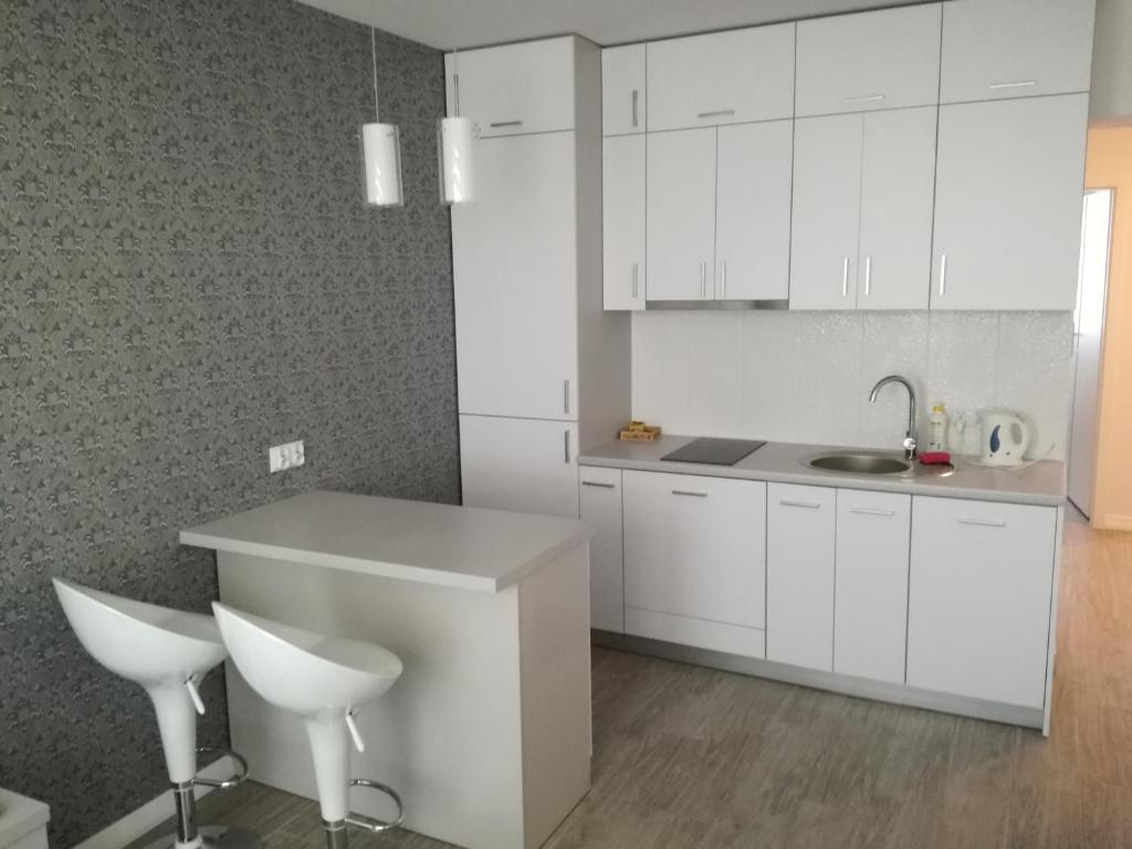 Kuchyňa alebo kuchynka v ubytovaní Nordic Apartamenty Suraska