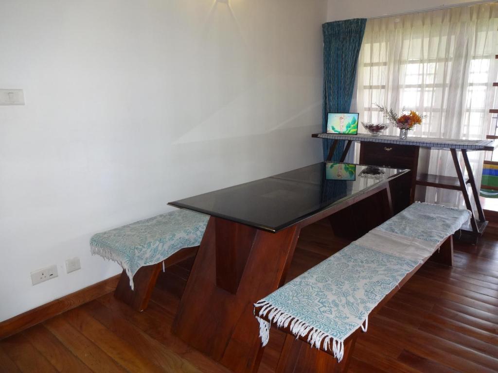Posezení v ubytování Irinjalakuda House