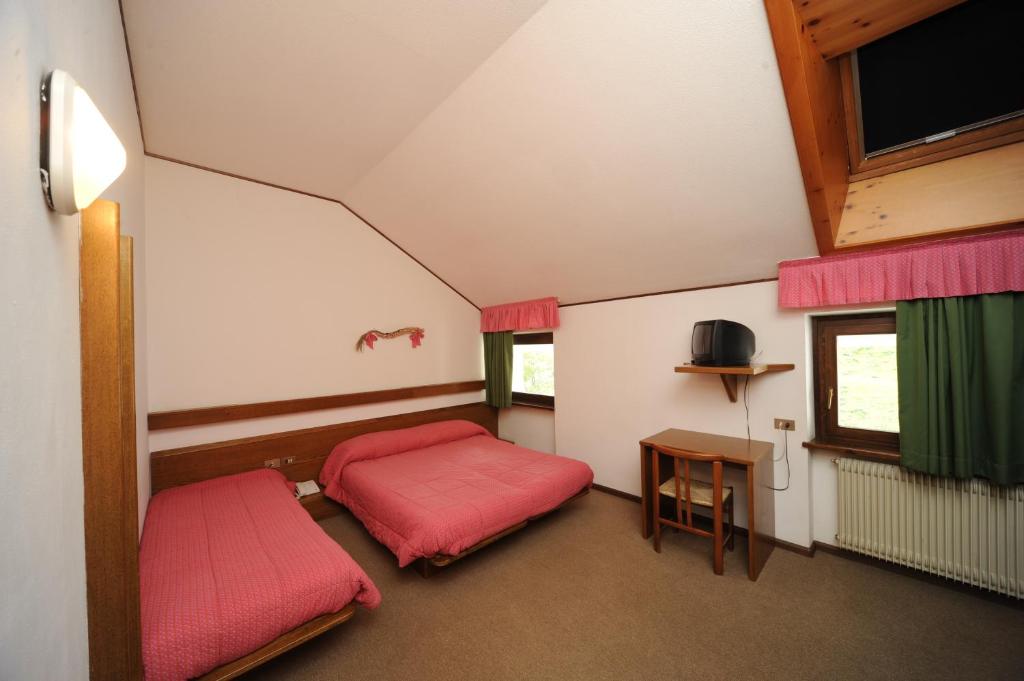 Postel nebo postele na pokoji v ubytování Hotel Compet