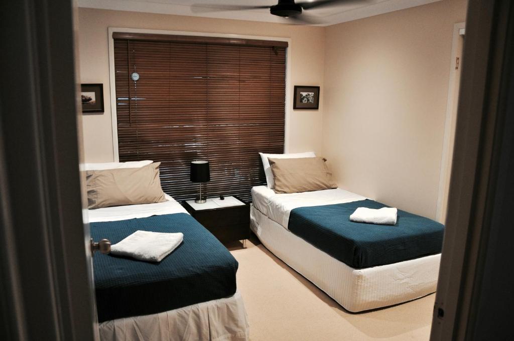 Postel nebo postele na pokoji v ubytování TL Warmest Homestay