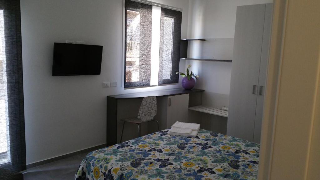 Postel nebo postele na pokoji v ubytování la Terrazza B&B
