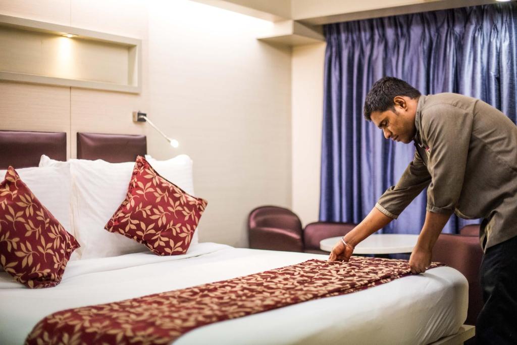 Postel nebo postele na pokoji v ubytování Hotel Oriental Aster - Mumbai International Airport