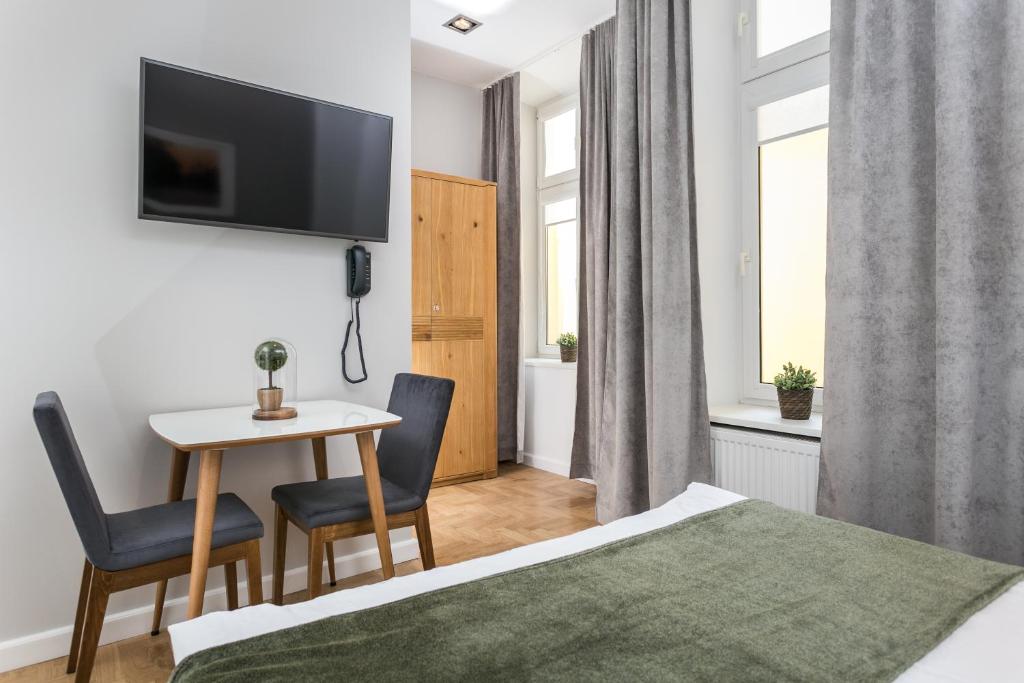 Posteľ alebo postele v izbe v ubytovaní Venetian House Market Square Aparthotel