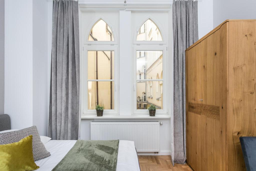 Posteľ alebo postele v izbe v ubytovaní Venetian House Market Square Aparthotel