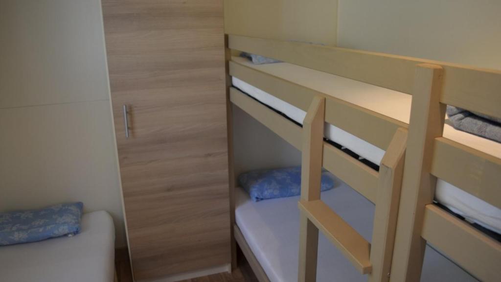 Postel nebo postele na pokoji v ubytování Camping U Libecciu