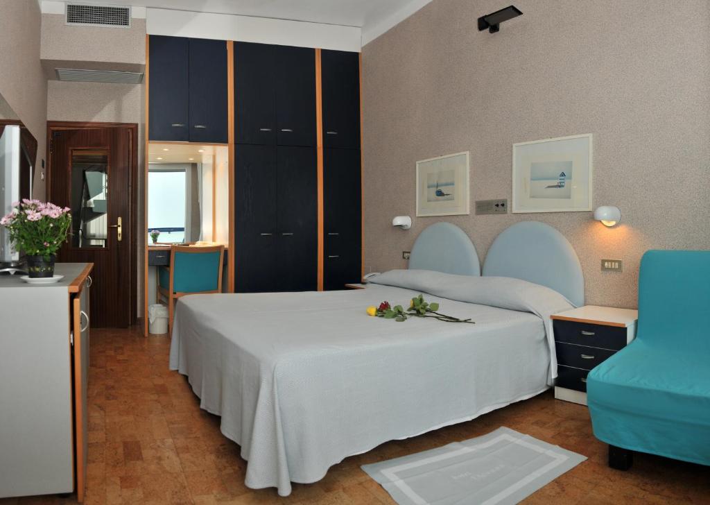 Postel nebo postele na pokoji v ubytování Hotel Venere