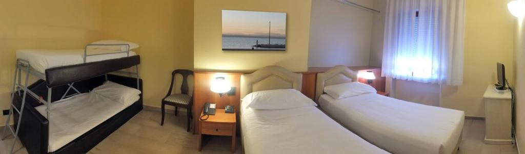 Postel nebo postele na pokoji v ubytování Veronello Resort