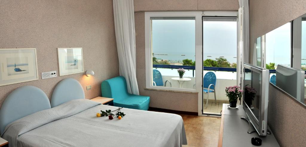 Postel nebo postele na pokoji v ubytování Hotel Venere