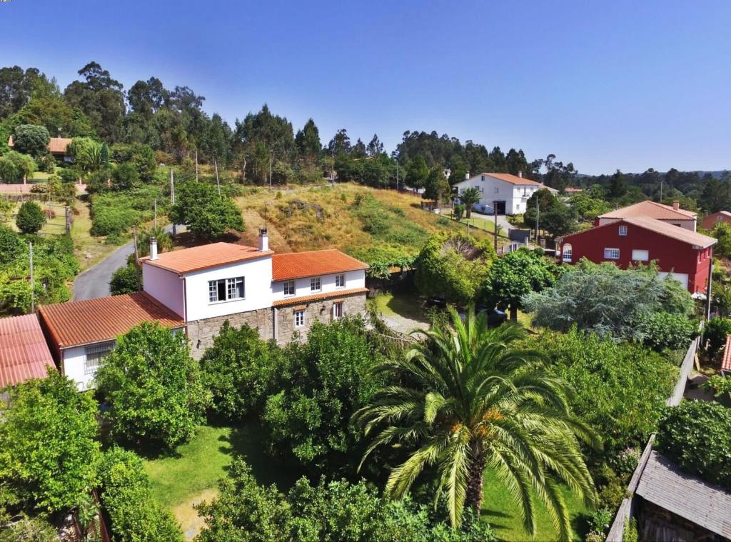 an aerial view of a house in a village at Casa Cunha in Cornanda