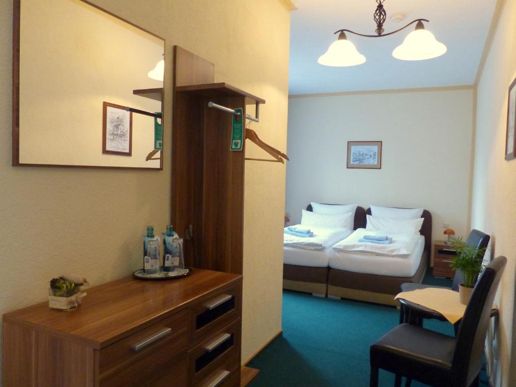 Voodi või voodid majutusasutuse Hotel Friedchen mit eigener Fleischerei toas