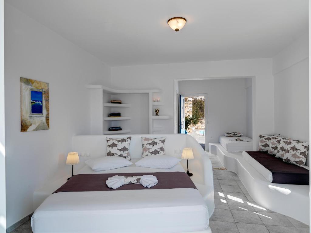 Postel nebo postele na pokoji v ubytování Aloni Hotel & Suites