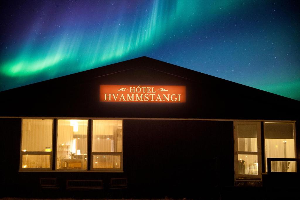 a building with a sign on the top of it at Hotel Hvammstangi Guesthouse in Hvammstangi