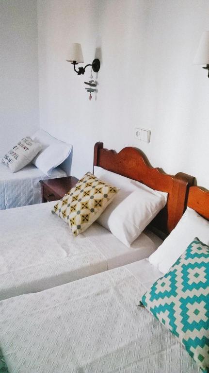 Postel nebo postele na pokoji v ubytování Hostal Rey