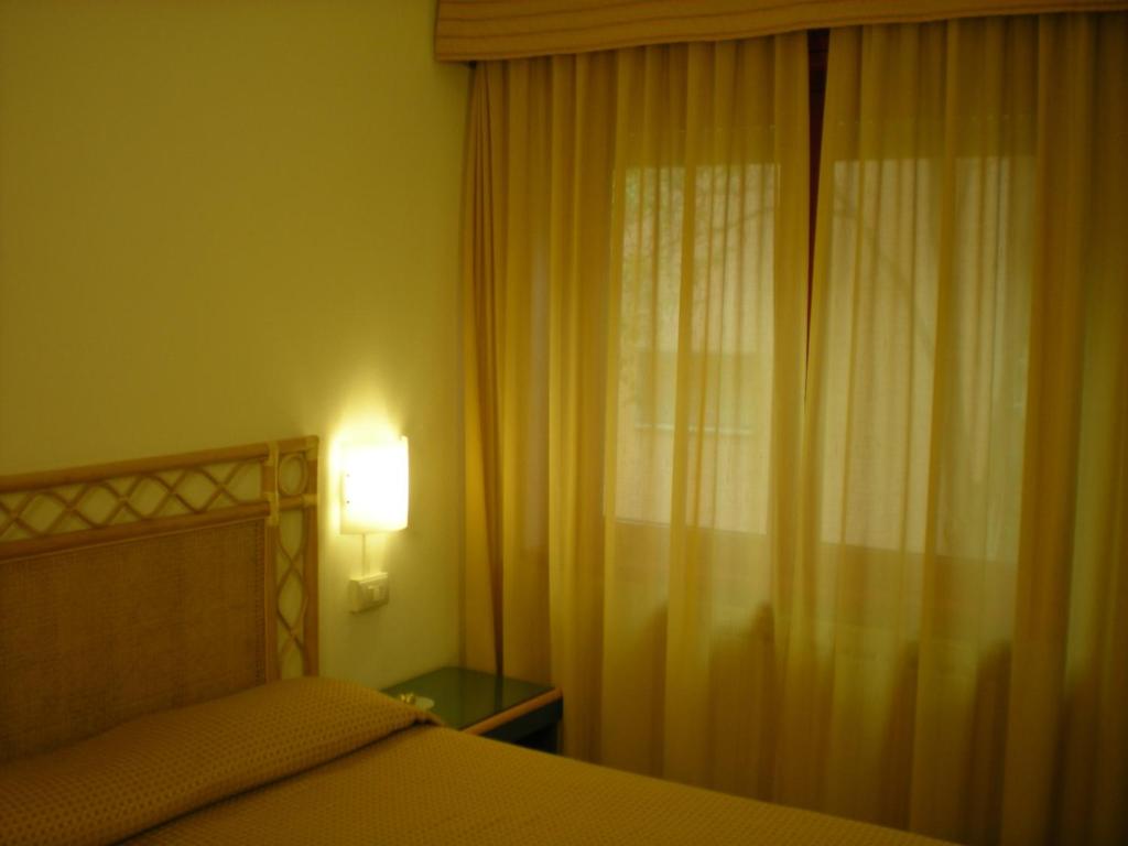 Postel nebo postele na pokoji v ubytování Hotel Palme