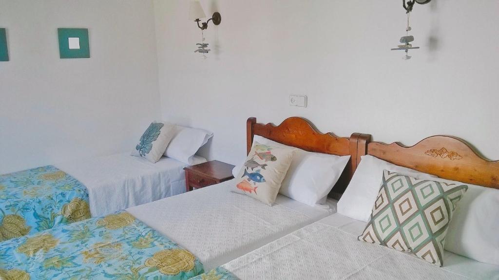 Postel nebo postele na pokoji v ubytování Hostal Rey