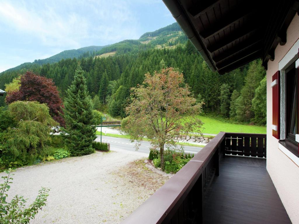 a balcony with a view of a road and trees at Fantastic chalet in Saalbach Hinterglemm Salzburgerland for 22 people in Saalbach Hinterglemm