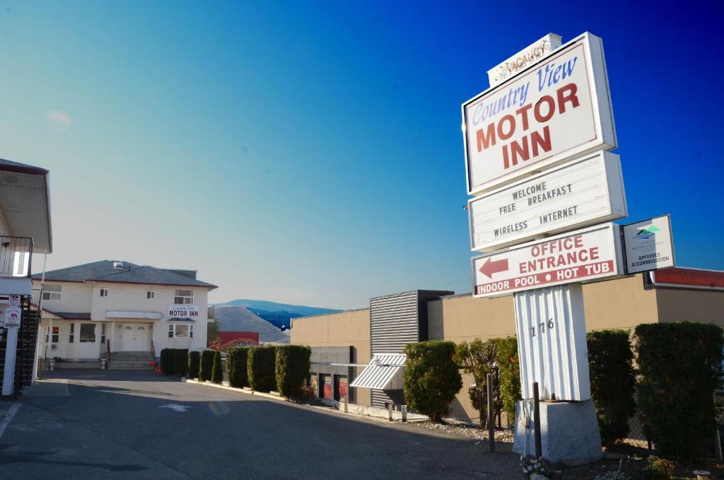 a sign for a motor inn on a street at Country View Motor Inn in Kamloops