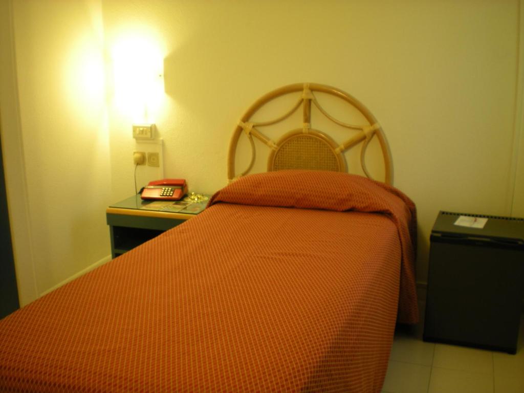 Postel nebo postele na pokoji v ubytování Hotel Palme