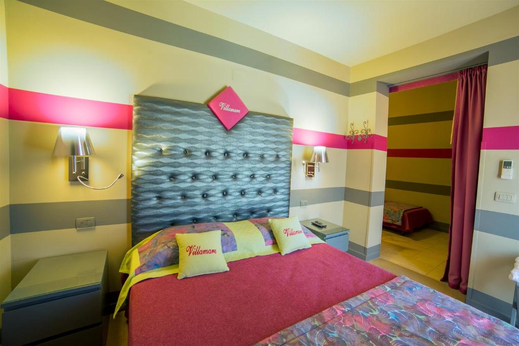 Cama ou camas em um quarto em Hotel Villamare