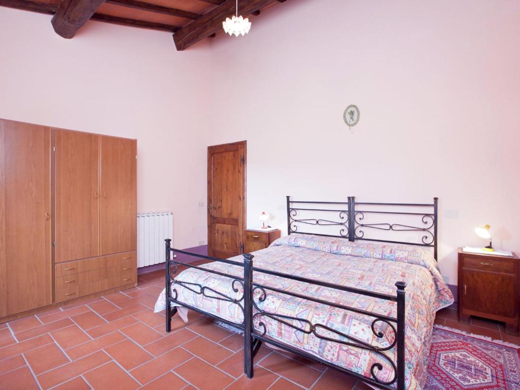 Postel nebo postele na pokoji v ubytování Farmhouse in Pienza with Pool and Views