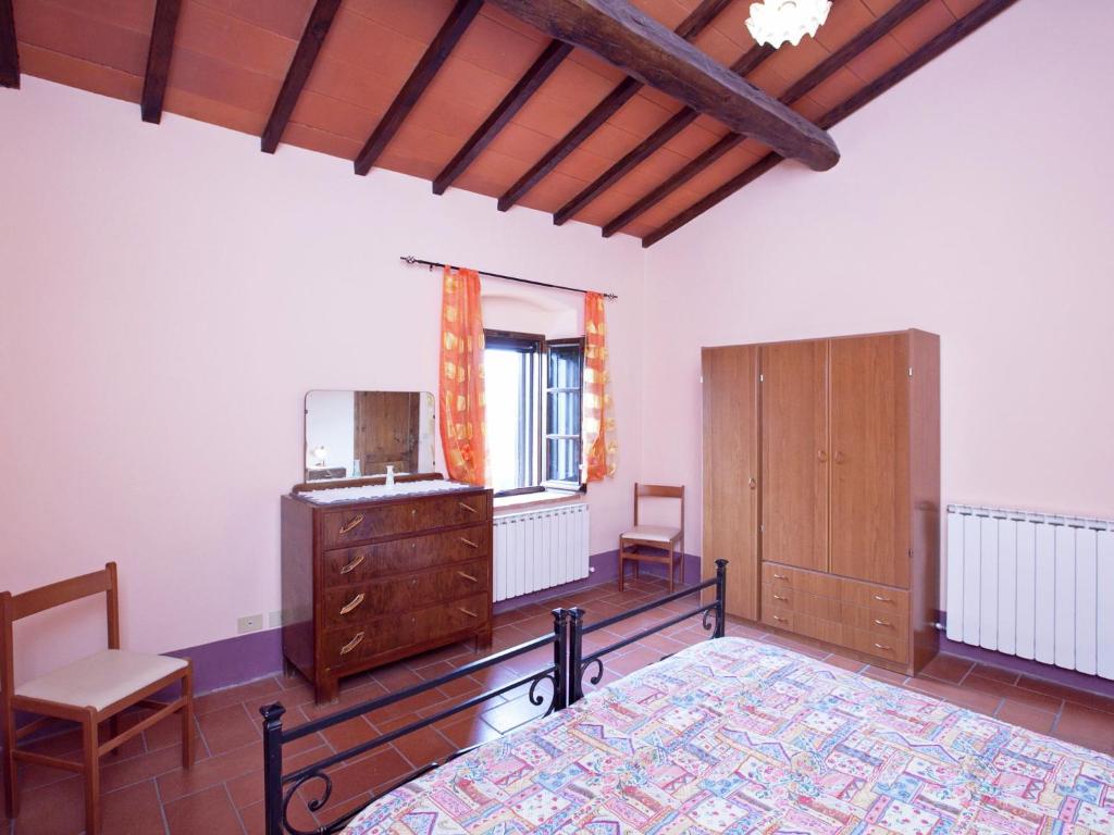Postel nebo postele na pokoji v ubytování Farmhouse in Pienza with Pool and Views
