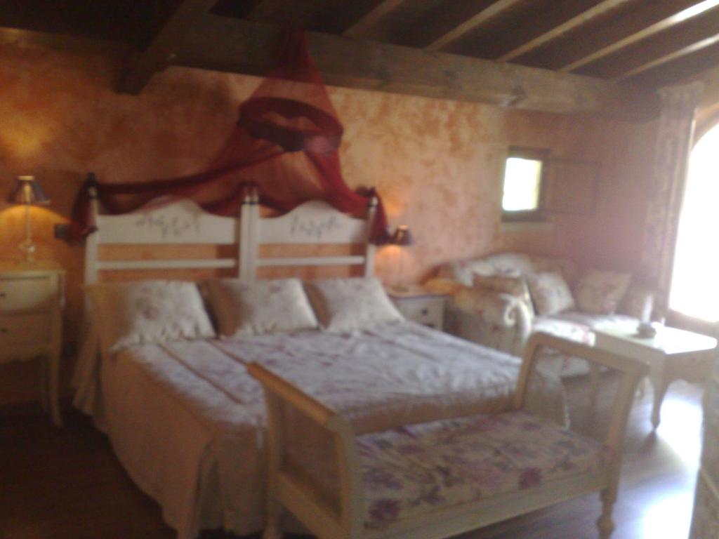 Cama o camas de una habitación en Complejo Rural El Marañal