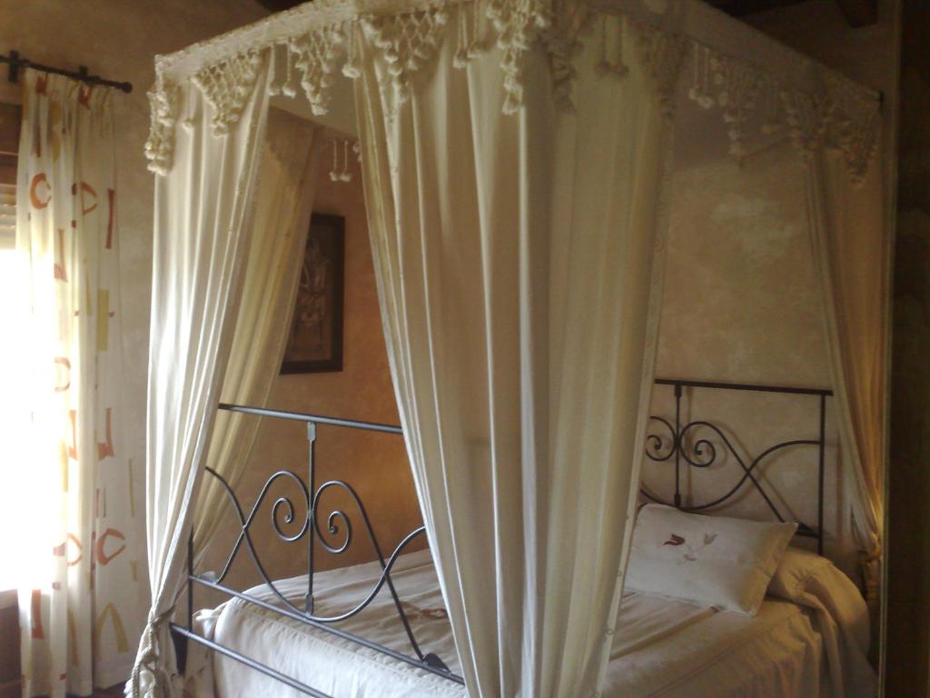 Cama o camas de una habitación en Complejo Rural El Marañal