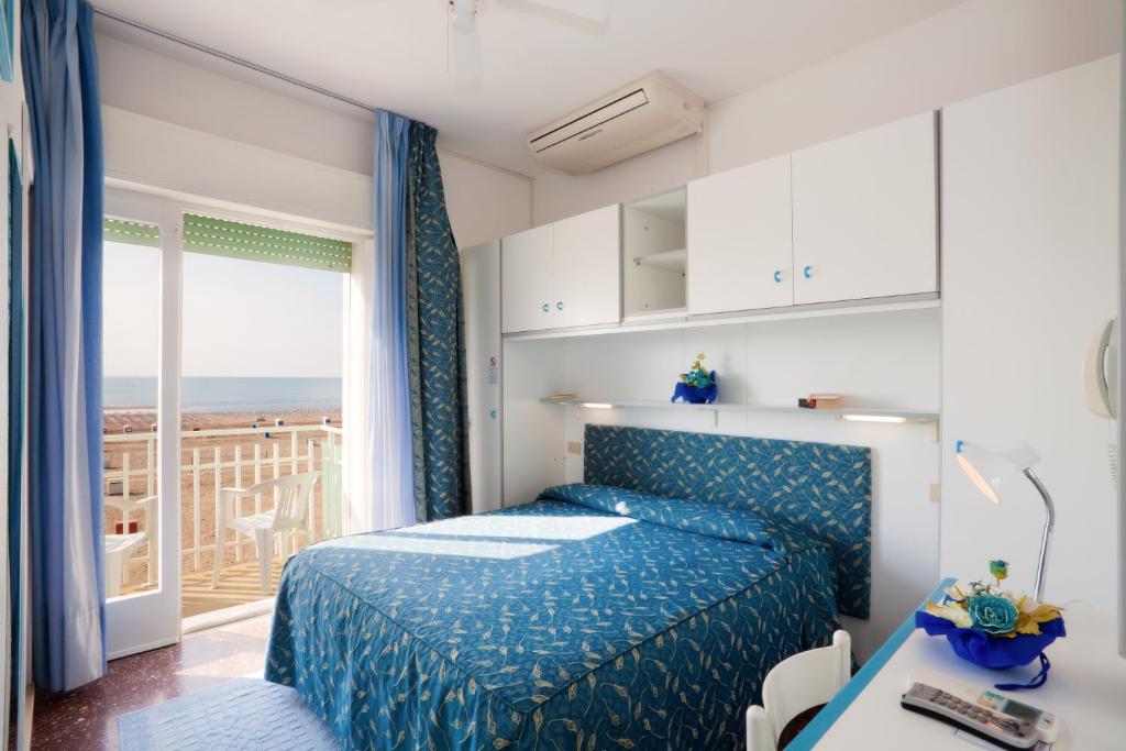 Postel nebo postele na pokoji v ubytování Hotel Sanremo
