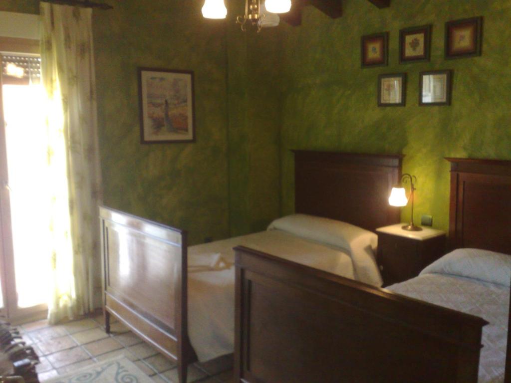 Cama o camas de una habitación en Complejo Rural El Marañal