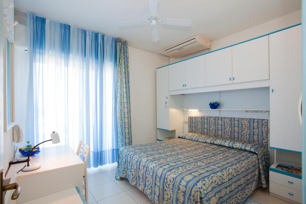 Postel nebo postele na pokoji v ubytování Hotel Sanremo