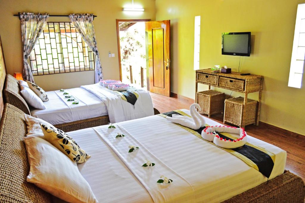 Postel nebo postele na pokoji v ubytování Atmaland Resort