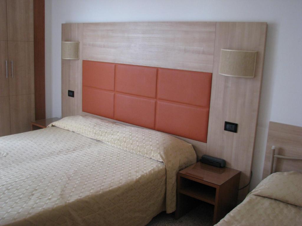 Postel nebo postele na pokoji v ubytování Hotel Fabius