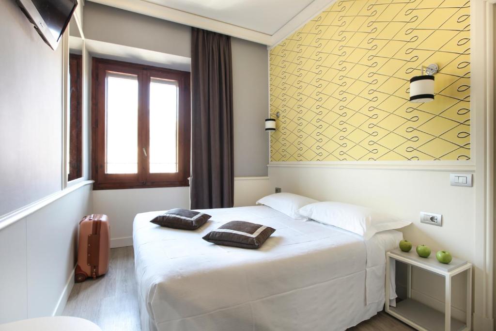 Łóżko lub łóżka w pokoju w obiekcie Hotel Golf